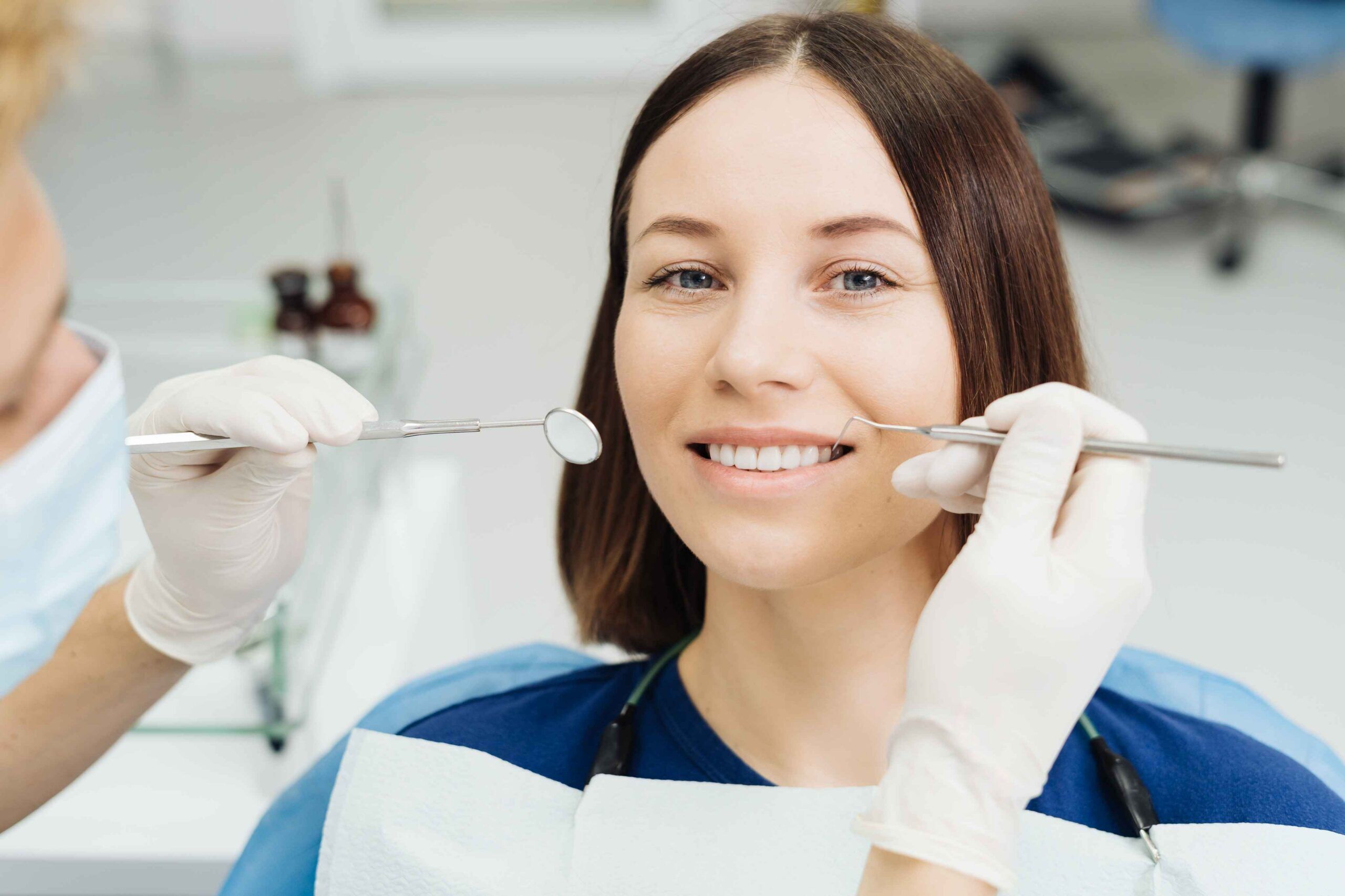 Woman receiving dental treatment in a dental clinic.